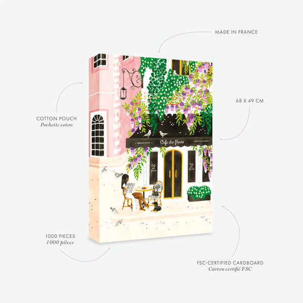 Specs for the Paris Café des Fleurs 1000-piece puzzle. Showcases the premium packaging and cotton pouch. The hand-painted illustration captures a classic Parisian café terrace with wisteria flowers and a chic woman with her dog.