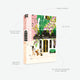 Specs for the Paris Café des Fleurs 1000-piece puzzle. Showcases the premium packaging and cotton pouch. The hand-painted illustration captures a classic Parisian café terrace with wisteria flowers and a chic woman with her dog.