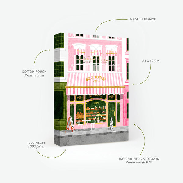 Technical details of the Pink Bakery 1000-piece puzzle by All the Ways to Say. Shows premium specs and the included cotton pouch. The artwork captures a vibrant pink "Biscuit Boutique" storefront with a striped awning and a Dalmatian dog waiting outside.