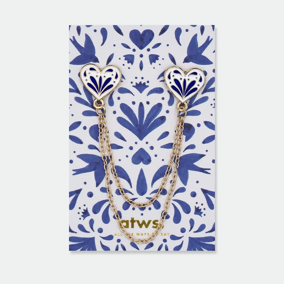 Enamel pin set of two blue and white heart-shaped pins connected by two gold chains, inspired by traditional ceramic patterns