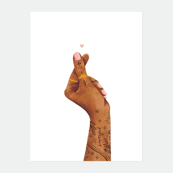 Illustrated poster of a hand forming a small heart shape with two fingers, delicate tattoos on the arm, and the word "grateful" written along the wrist, a tiny pink heart floating above