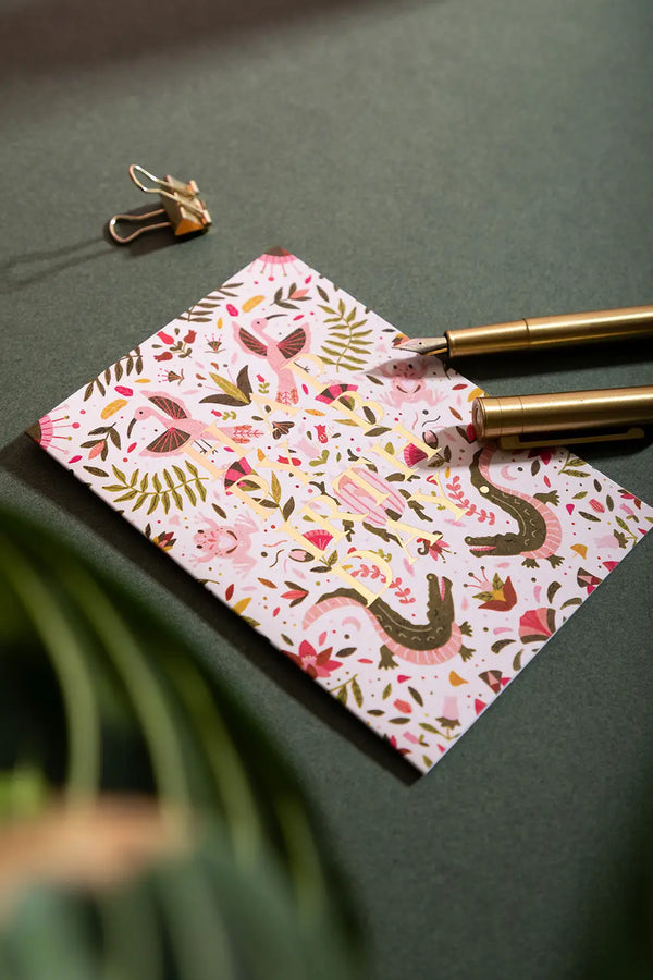 Happy birthday pink croco Greeting card - Hand-painted illustration featuring pink crocodiles and tropical birds on a white background.