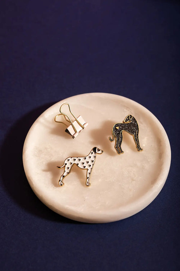 Greyhound - Pins: collection of dog pins including a black greyhound and a white dalmatian on marble.