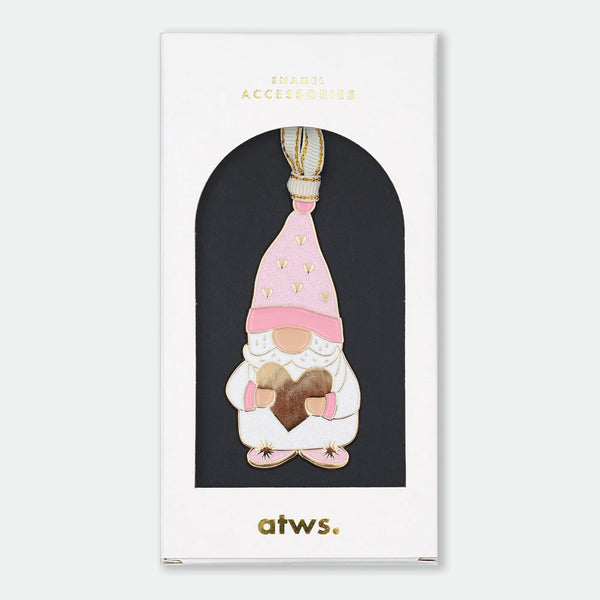 Gold-tone enamel Christmas ornament of a gnome in a pink heart-patterned hat, holding a gold heart with both hands