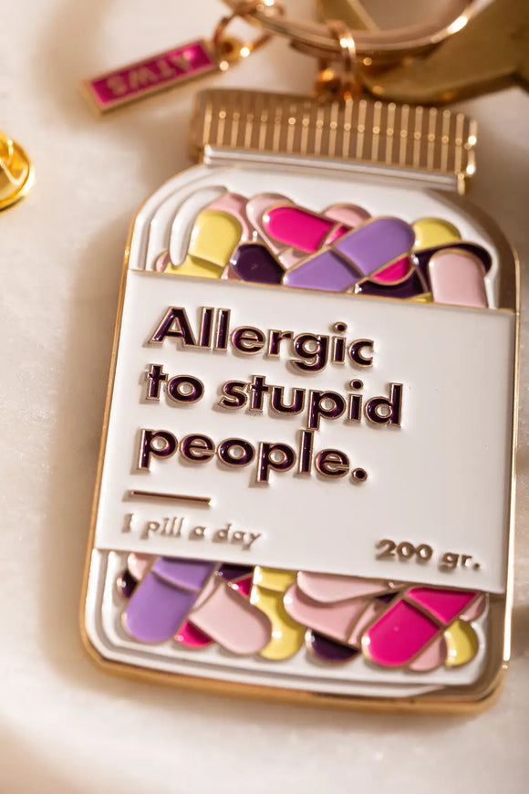 Allergic to stupid people Keychain - Focus on the engraved text and vibrant pill jar design.