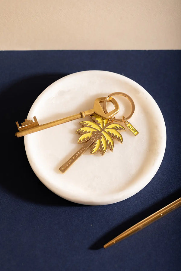 Beach please Keychain - Palm tree illustration on a marble tray with a vintage key.