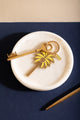 Beach please Keychain - Palm tree illustration on a marble tray with a vintage key.