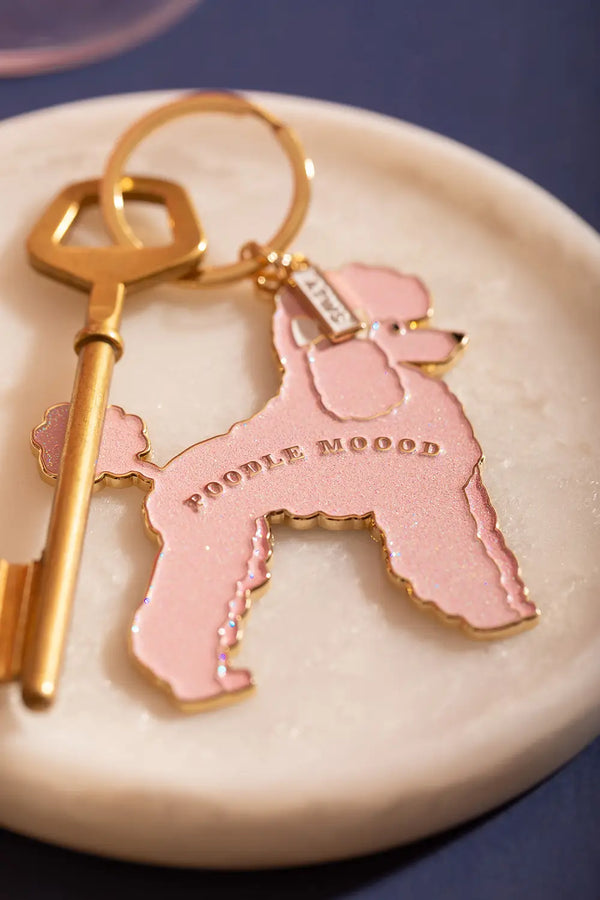 Poodle mood Keychain - Detailed view of the pink glitter poodle and golden "POODLE MOOOD" engraving.