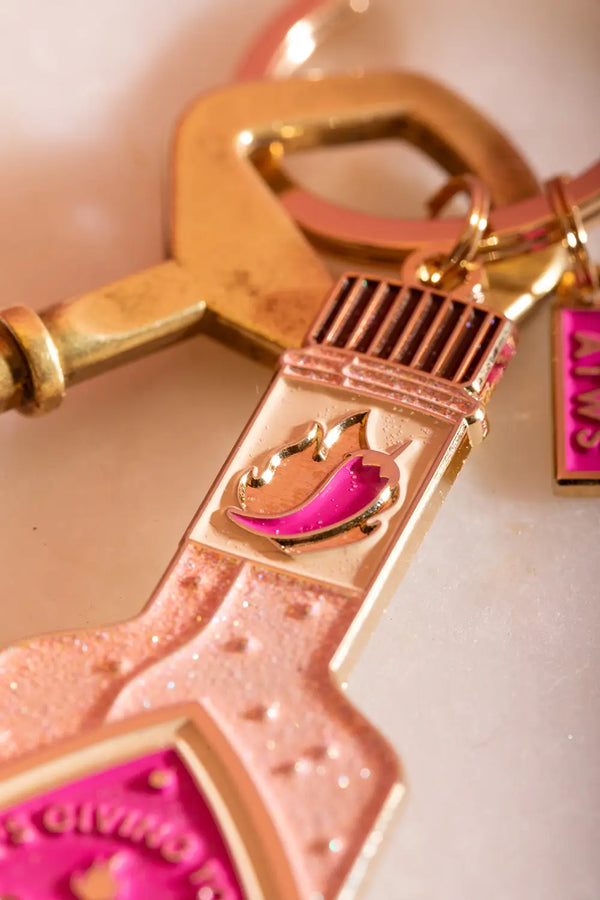 Spicy & Hot Keychain - Close-up of the bottle neck featuring a pink chili pepper and flame design.