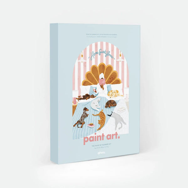 Life Without Humans paint by numbers kit box by All The Ways To Say, illustration of a person reading in bed surrounded by four dogs and three cats, "Home Sweet Home" text arched over a scalloped headboard, "paint art. The Paint By Number Kit by All The Ways To Say"