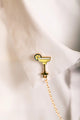 Duo Margarita Chain - Pins: the margarita glass element of the chain pin worn on a white collar.