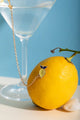 Duo Margarita Chain - Pins: a lemon-shaped pin and a cocktail glass pin connected by a gold chain.