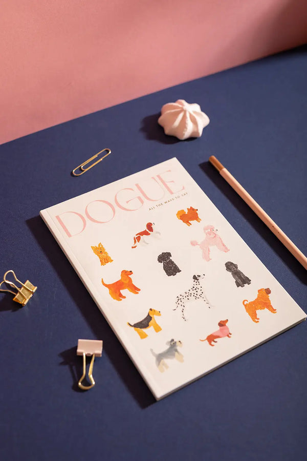 Dog(ue) Notebook A5 - Lifestyle view on a navy desk featuring various hand-painted dog breeds.