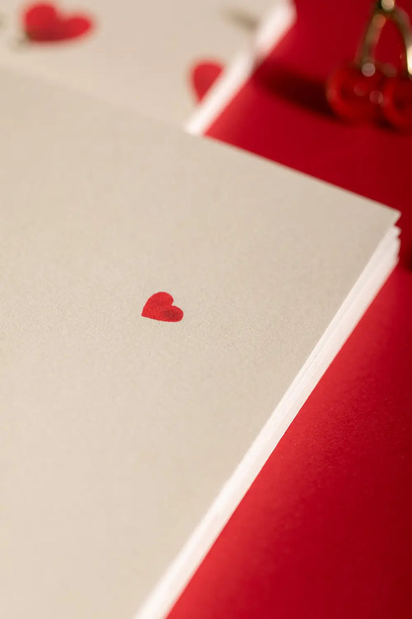 Notebook A5 New Hearts - Interior view of the white pages featuring a small red heart detail.