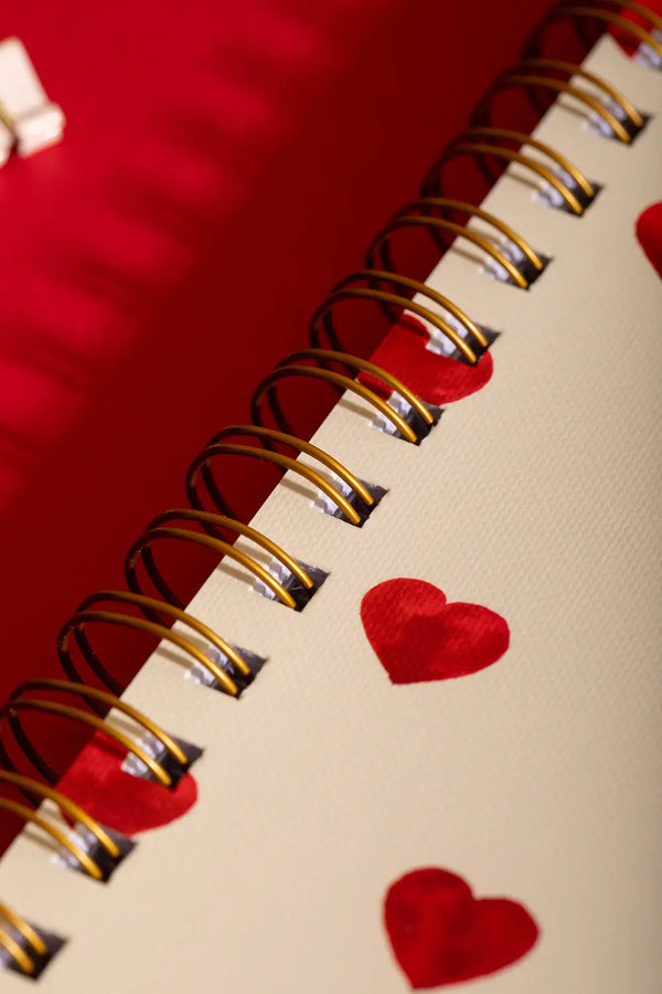 Heart Notebook Spiral - Macro shot of the premium gold double-wire binding and red hearts.