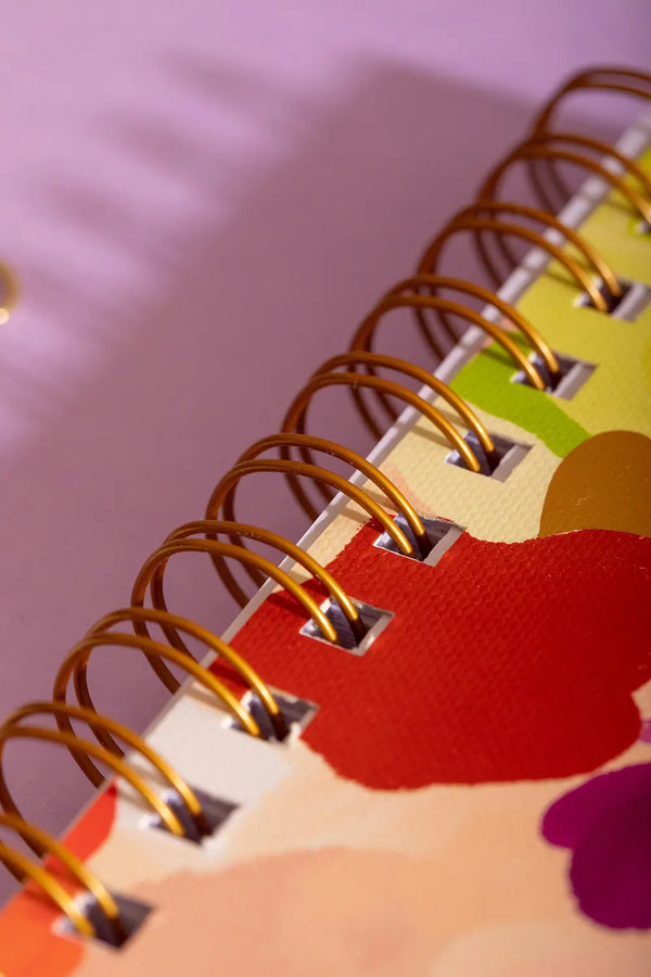 Spring Sweets Spiral Notebook - Macro shot of the premium gold double-wire binding.