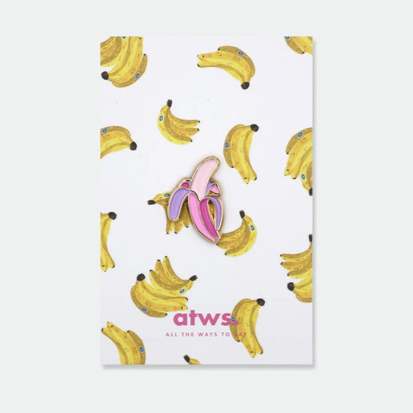 Enamel pin of a peeled banana in bold pink and purple