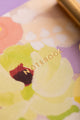 Spring Sweets Pocket Notebook A6 DUO - Macro shot of the gold foil title on floral background.