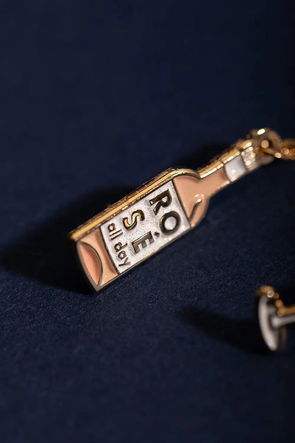 Duo Rose All Day Chain - Pins: macro shot showing the glittery "Rosé all day" text on the wine bottle pin.