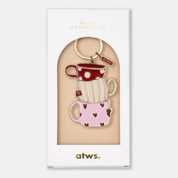 Enamel and metal keychain of three stacked teacups in red polka dot, cream stripe, and pink heart patterns, gold-tone ring and "ATWS" charm