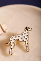 Dalmatian - Pins: Close-up of a white enamel dalmatian pin with small black heart spots.